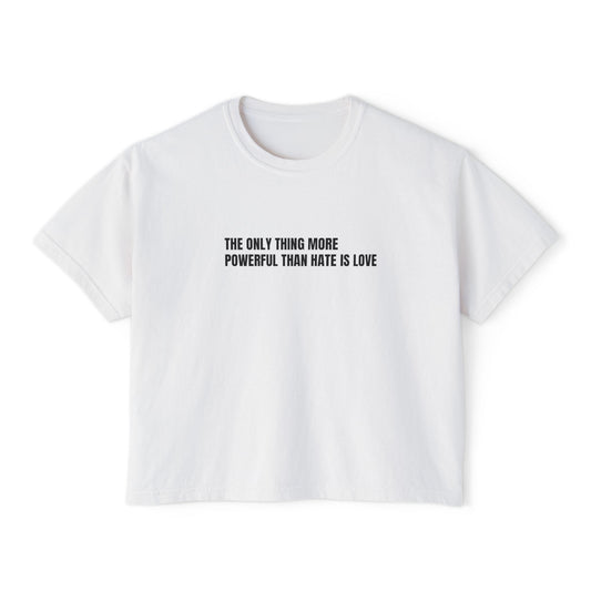 White t-shirt with black text "THE ONLY THING MORE POWERFUL THAN HATE IS LOVE" on a white background