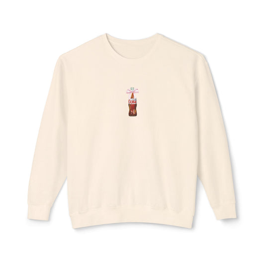 ivory sweater with a soda bottle graphic on a white background