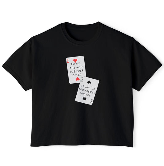 Black t-shirt with playing card designs and text on a white background