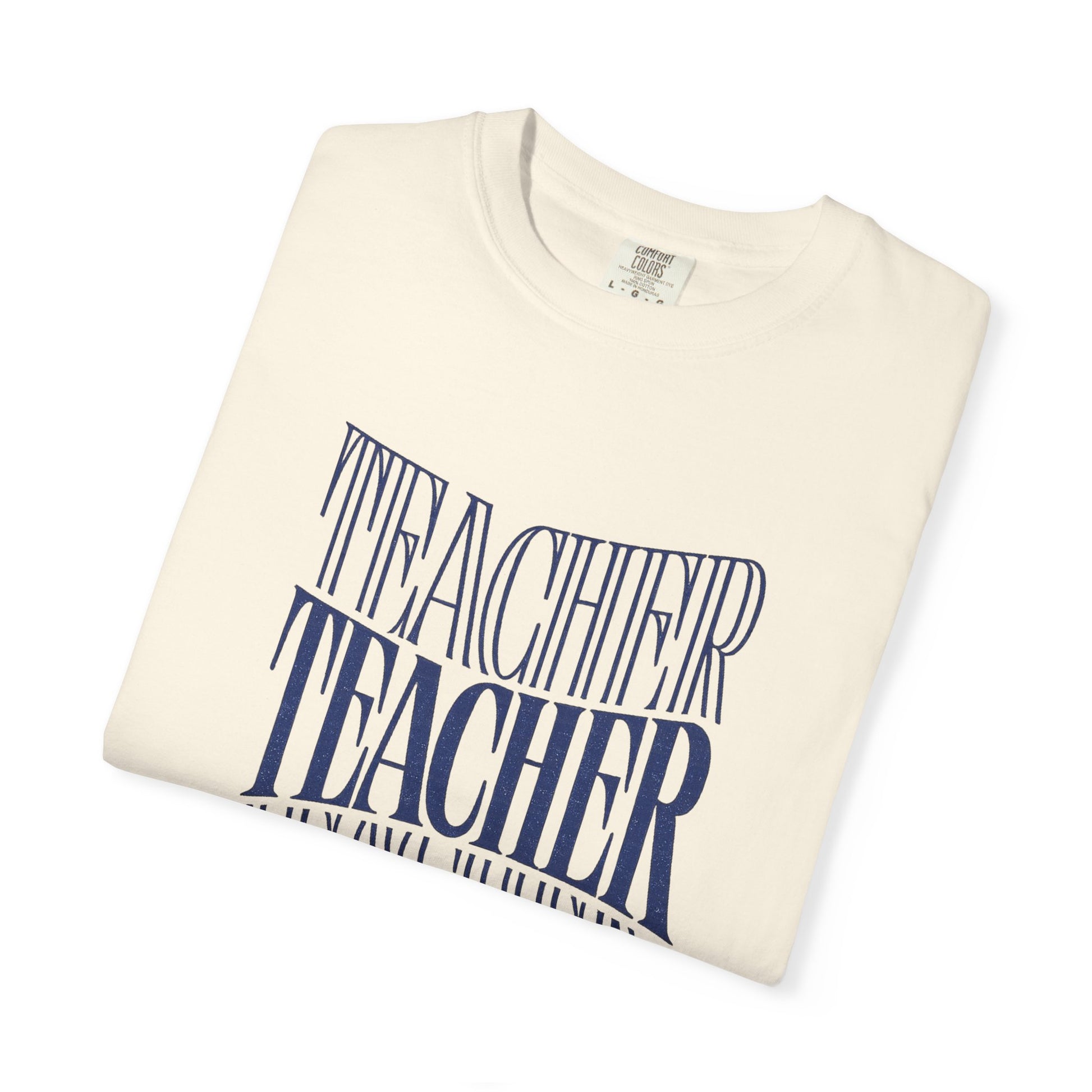 Folded cream-colored sweatshirt with 'Teacher shaping the future' printed in blue on a white background