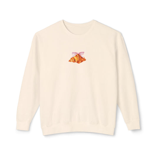 ivory sweatshirt with a small croissant design on the chest against a white background