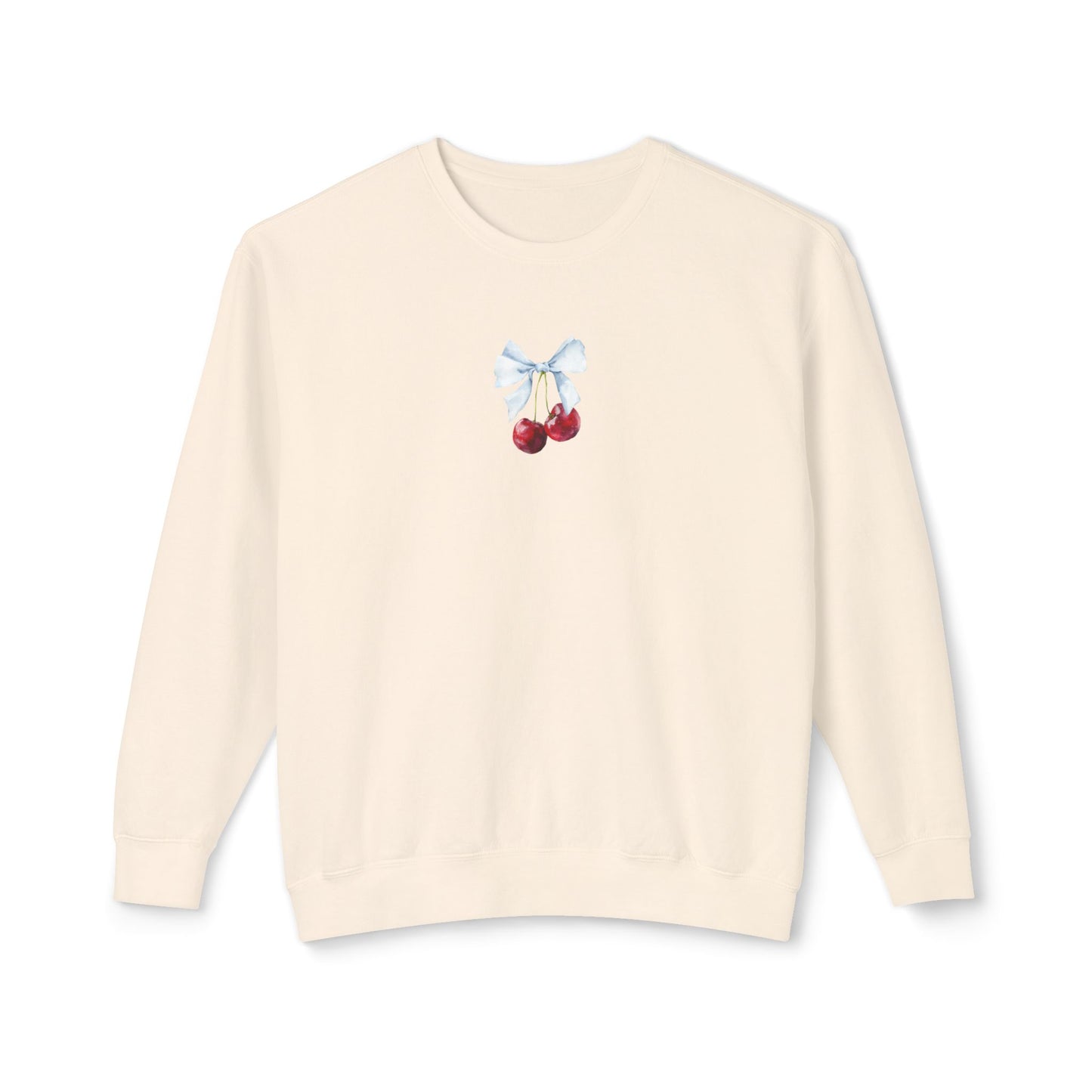 ivory sweater with cherry and bow design on a white background