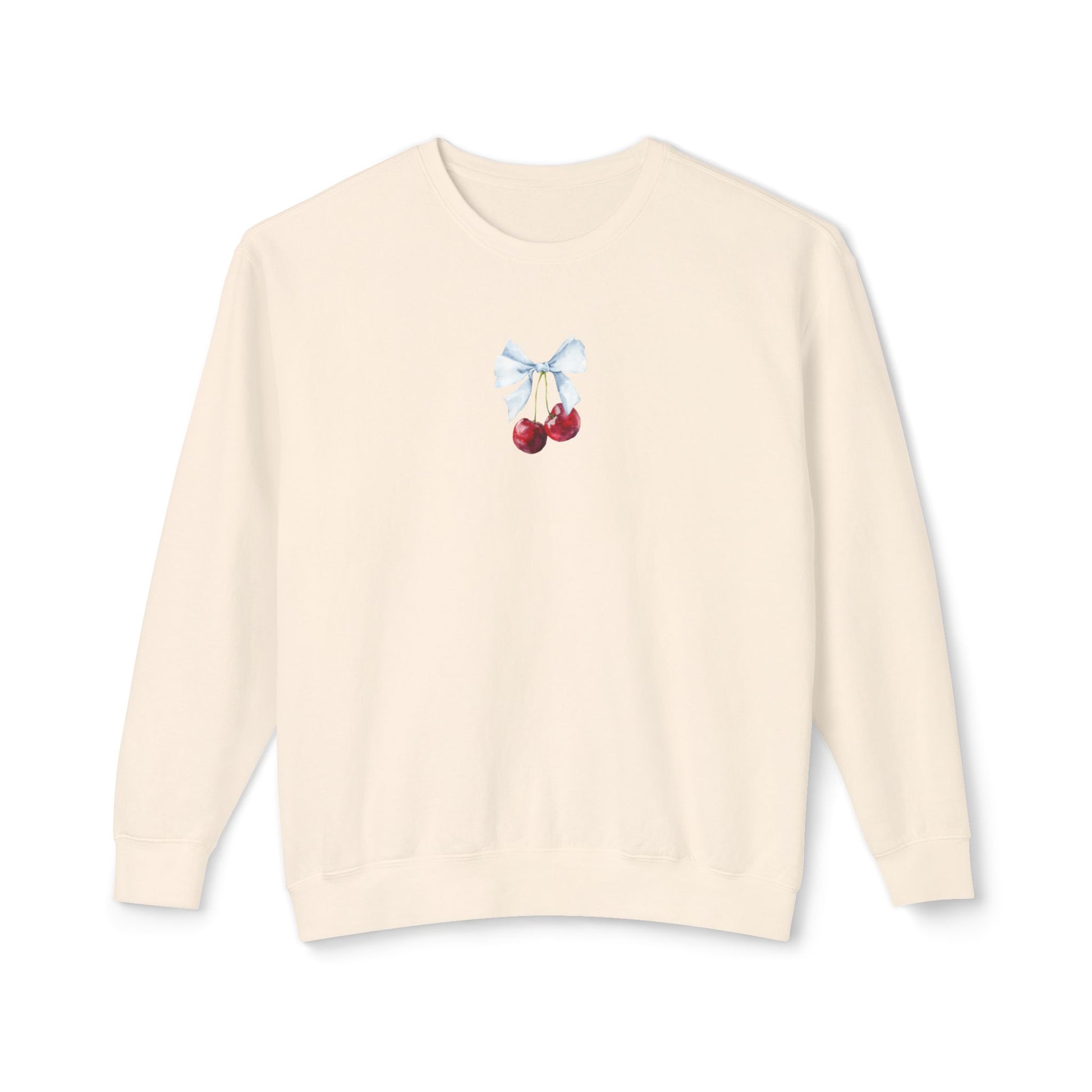 ivory sweater with cherry and bow design on a white background