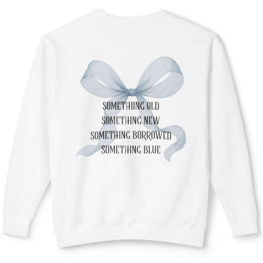White sweatshirt with a blue bow and text on a white background