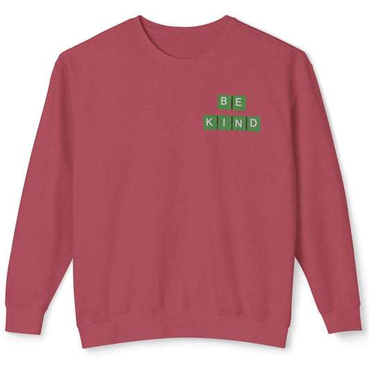 Red sweatshirt with 'BE KIND' text on a white background