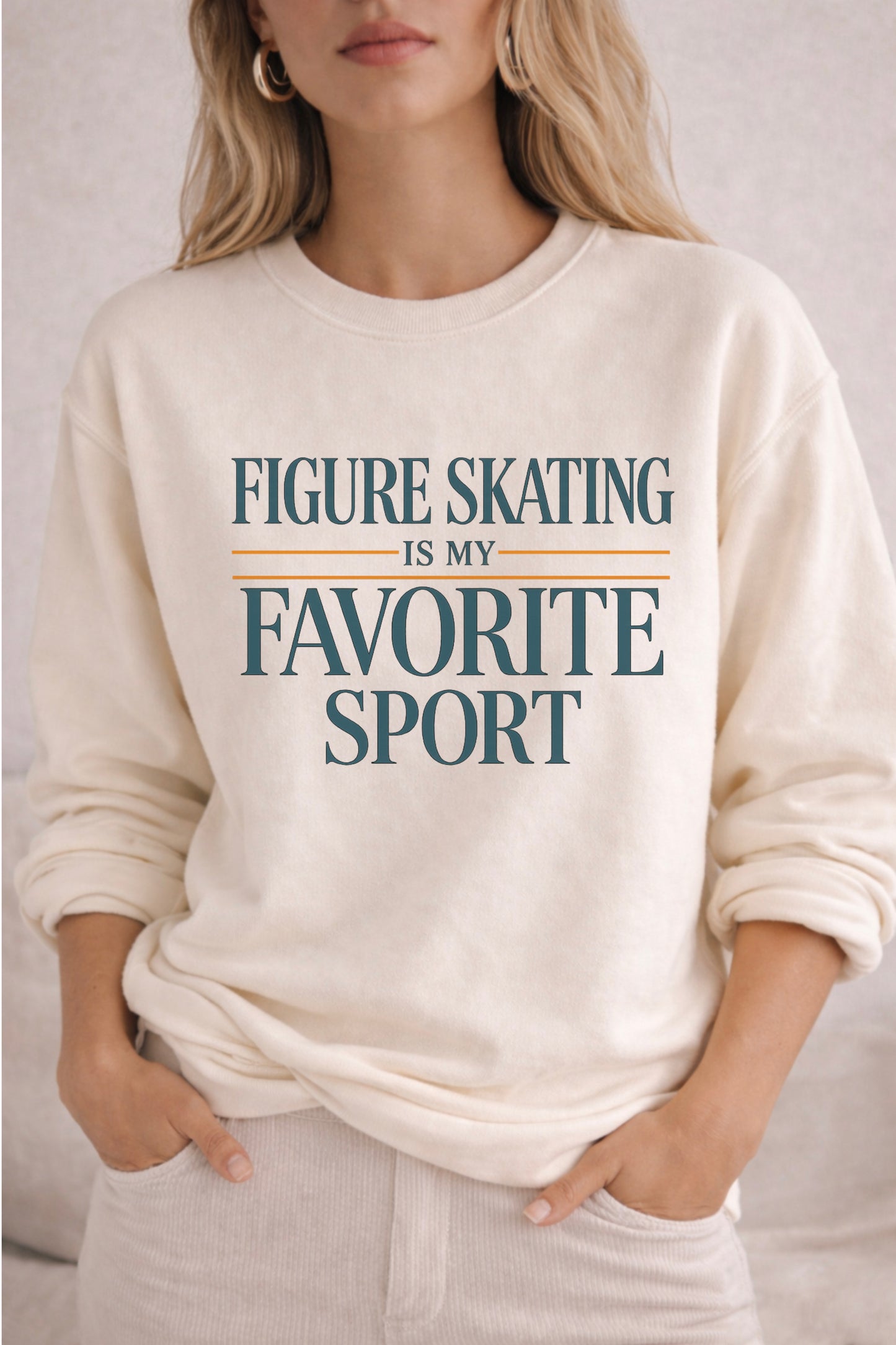 Person wearing a ivory sweatshirt with 'Figure Skating is my Favorite Sport' text.